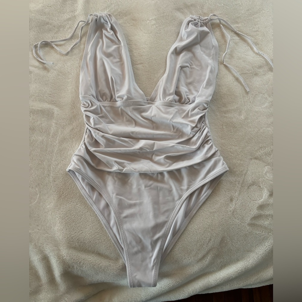 Flattering one piece swimsuit with ruching.